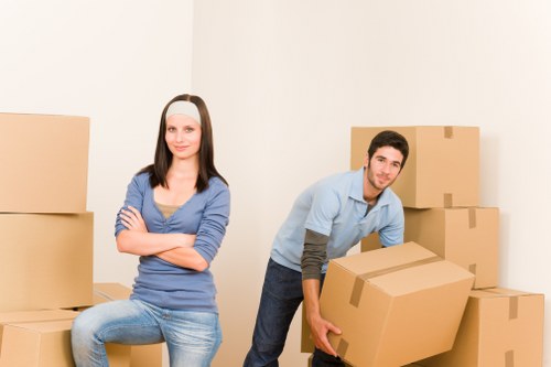 Office removal service with desks, boxes, and equipment being loaded